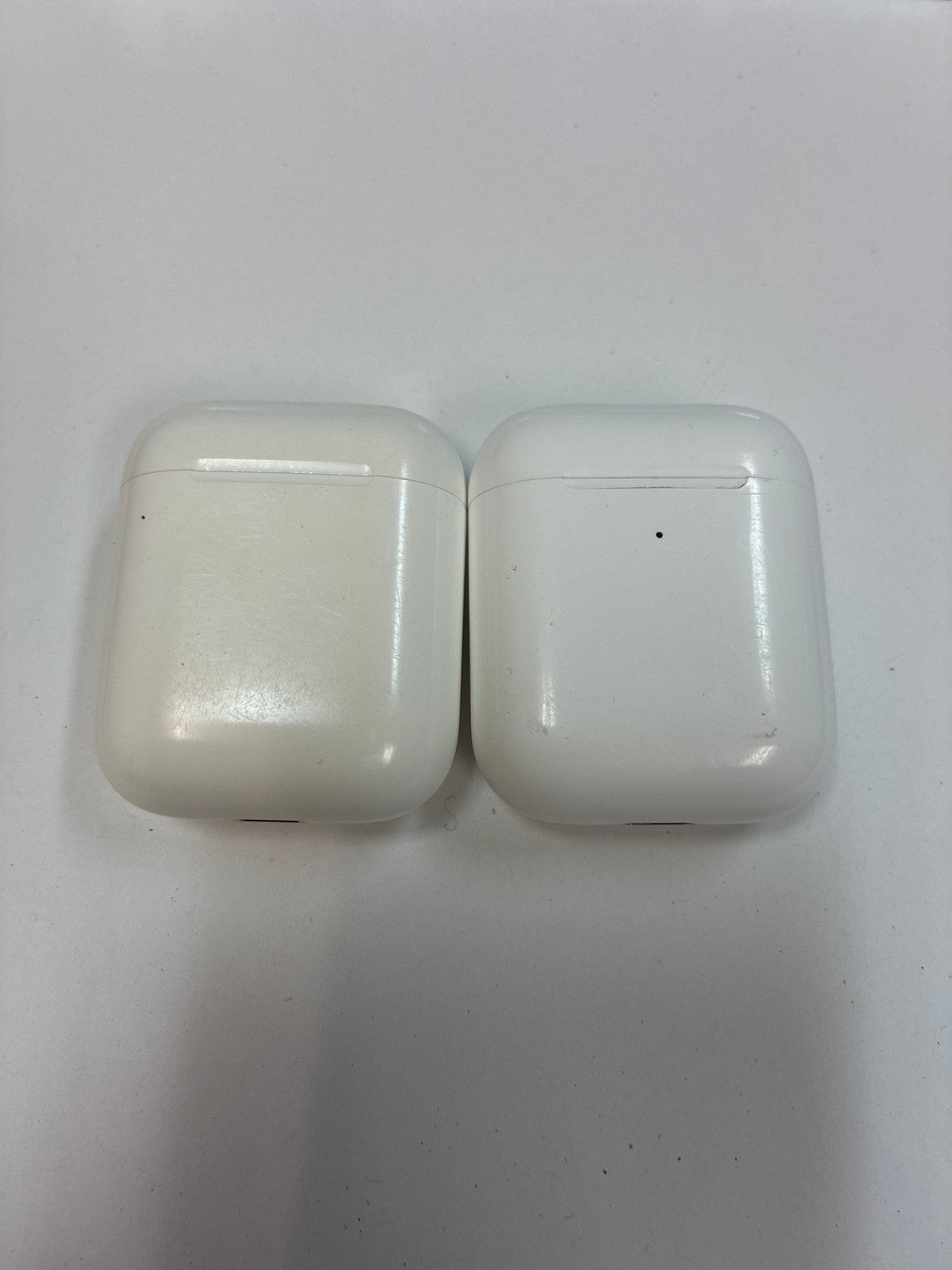 Lot of 2 Apple AirPods Lightning Charging Cases with one earbud