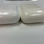 Lot of 2 Apple AirPods Lightning Charging Cases with one earbud