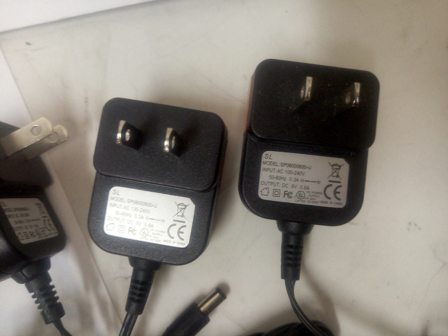 - LOT OF 4 SL SP08000600-U AC ADAPTER  OUTPUT: DC 8V 0.6A