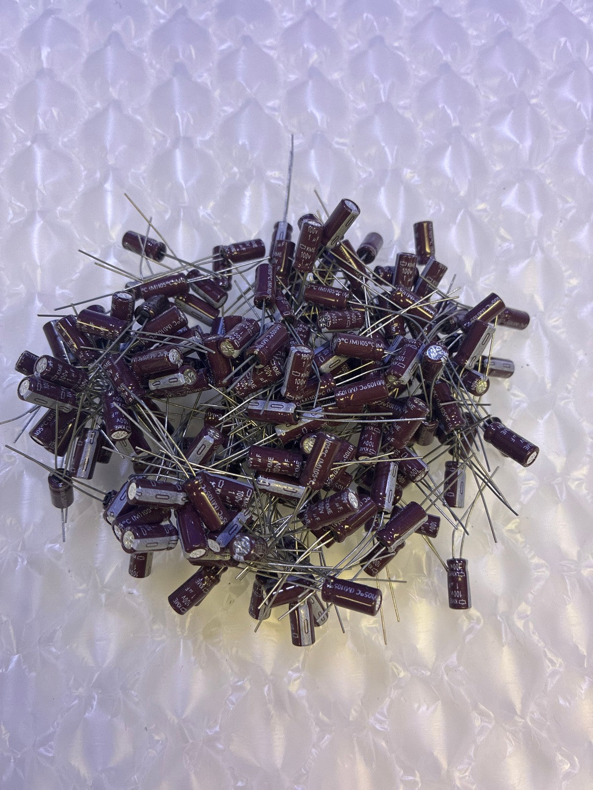 🔥 KME 1µF 100V 105°C Radial Electrolytic Capacitors – Bulk Lot of ~200